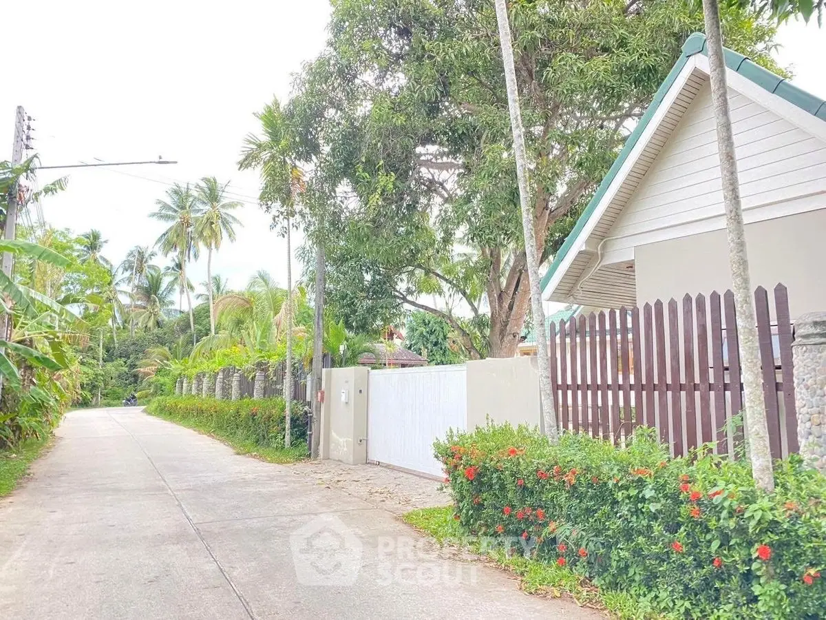 Charming tropical property with lush greenery and private entrance, ideal for serene living.