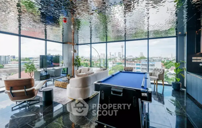 Luxurious living room with panoramic city views and stylish interior design.