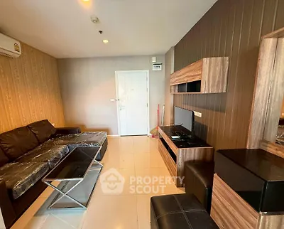 Modern living room with sleek furniture and stylish decor in a contemporary apartment.