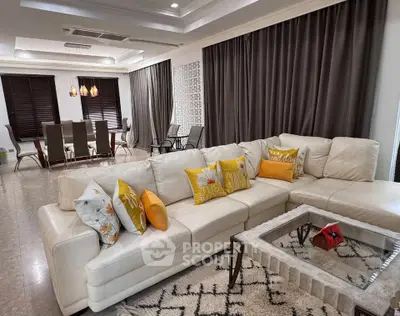 Luxurious living room with elegant dining area and stylish decor