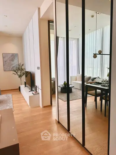 Modern open-plan living and dining area with sleek design and natural light