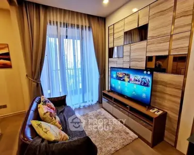Cozy living room with modern TV setup and elegant curtains