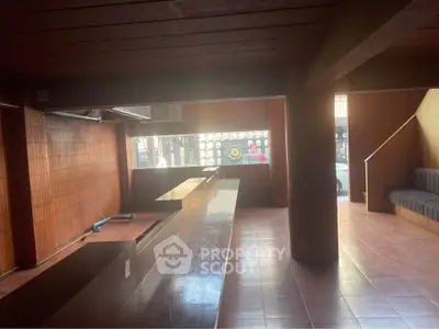Spacious commercial interior with wooden accents and large windows
