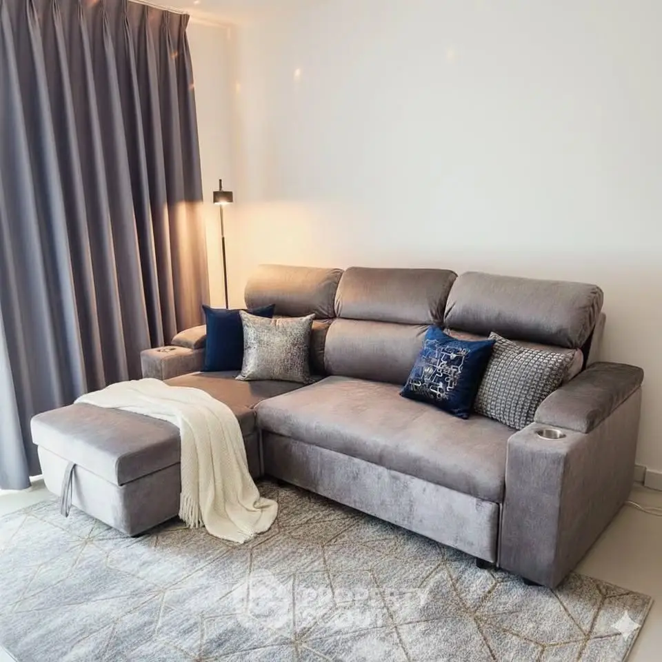 Stylish living room with plush gray sectional sofa and elegant decor