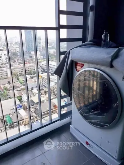High-rise balcony with city view and modern washing machine, perfect for urban living.