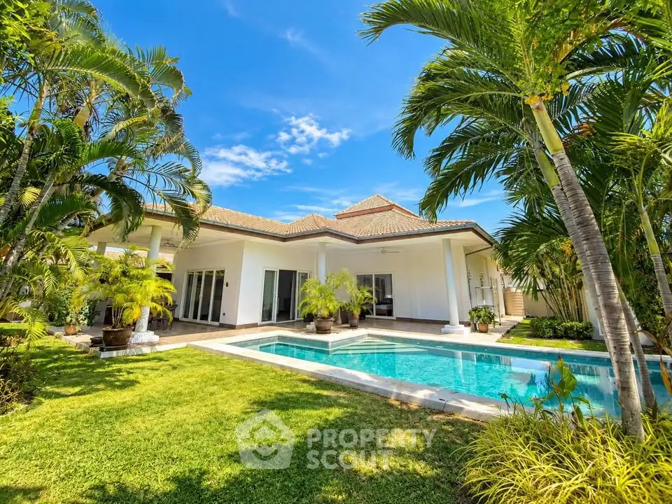 Luxurious villa with private pool and lush garden, perfect for tropical living.