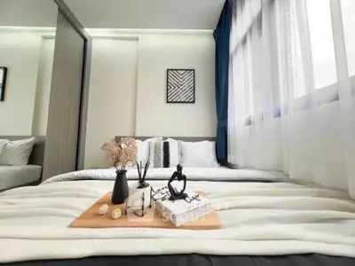 Modern bedroom with stylish decor and large window for natural light