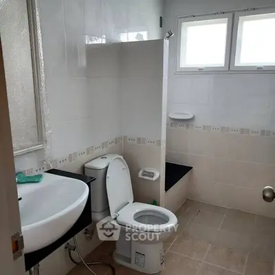 Spacious bathroom with modern fixtures and natural light