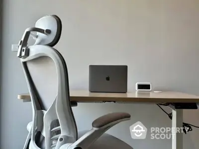 Modern home office setup with ergonomic chair and sleek desk