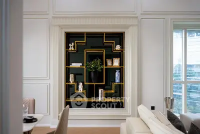 Elegant living room with modern shelving and large window view