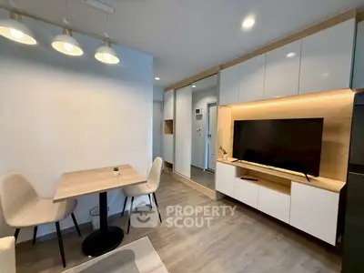 Modern living room with sleek furniture and built-in TV unit, perfect for cozy gatherings.