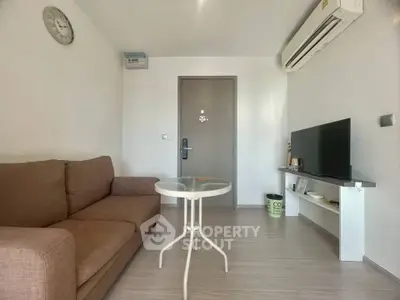 Modern living room with air conditioning and cozy sofa in a stylish apartment.