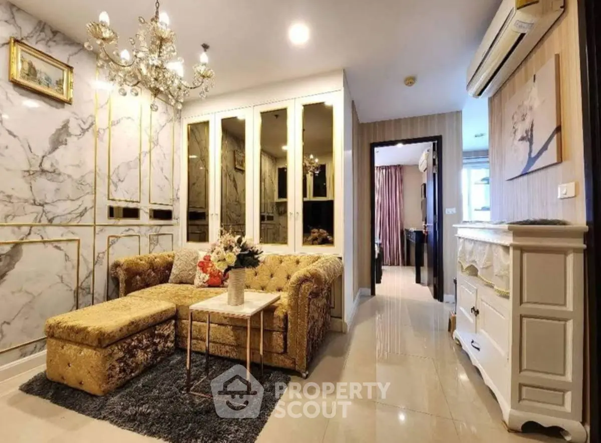 Luxurious living room with elegant decor and plush furniture in a modern apartment.