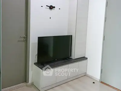 Modern living room with sleek TV stand and minimalist decor