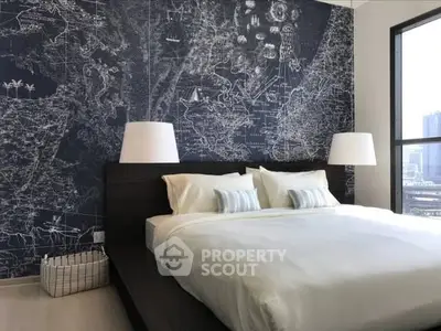 Modern bedroom with stylish map-themed accent wall and large windows offering city views.
