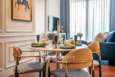 Elegant dining area with stylish decor and modern furniture in a luxurious apartment.