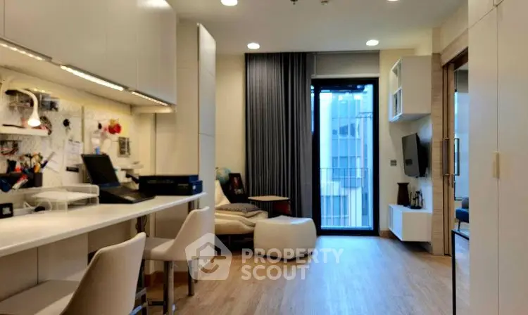 Modern living room with sleek design and city view balcony access