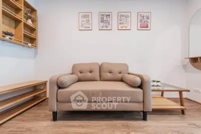 Stylish living room with modern beige sofa and elegant decor, perfect for cozy relaxation.