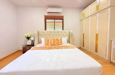 Luxurious bedroom with elegant decor and ample storage space