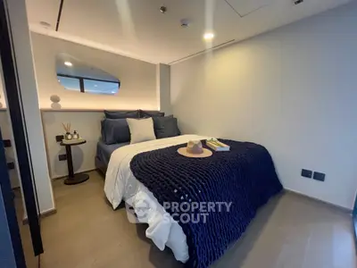 Cozy modern bedroom with stylish decor and ambient lighting