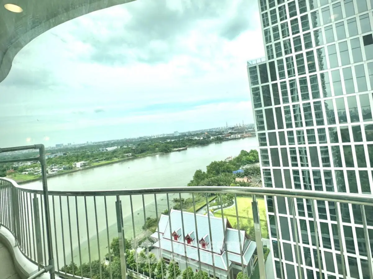 Stunning high-rise balcony view overlooking river and cityscape