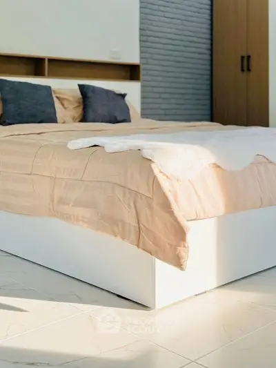 Modern bedroom with stylish decor and natural light