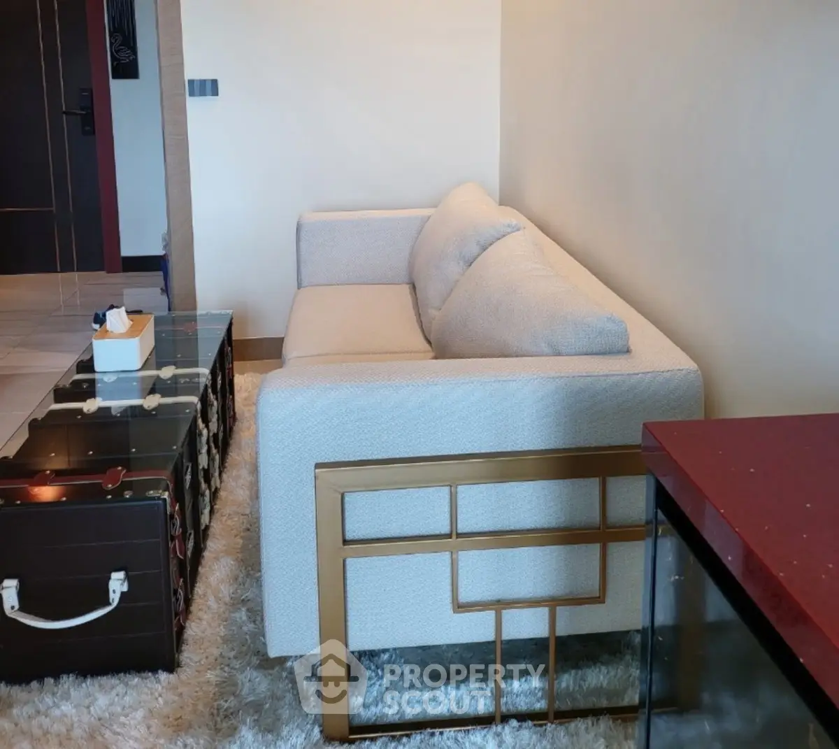 Stylish living room with modern sofa and chic decor in a luxurious apartment.