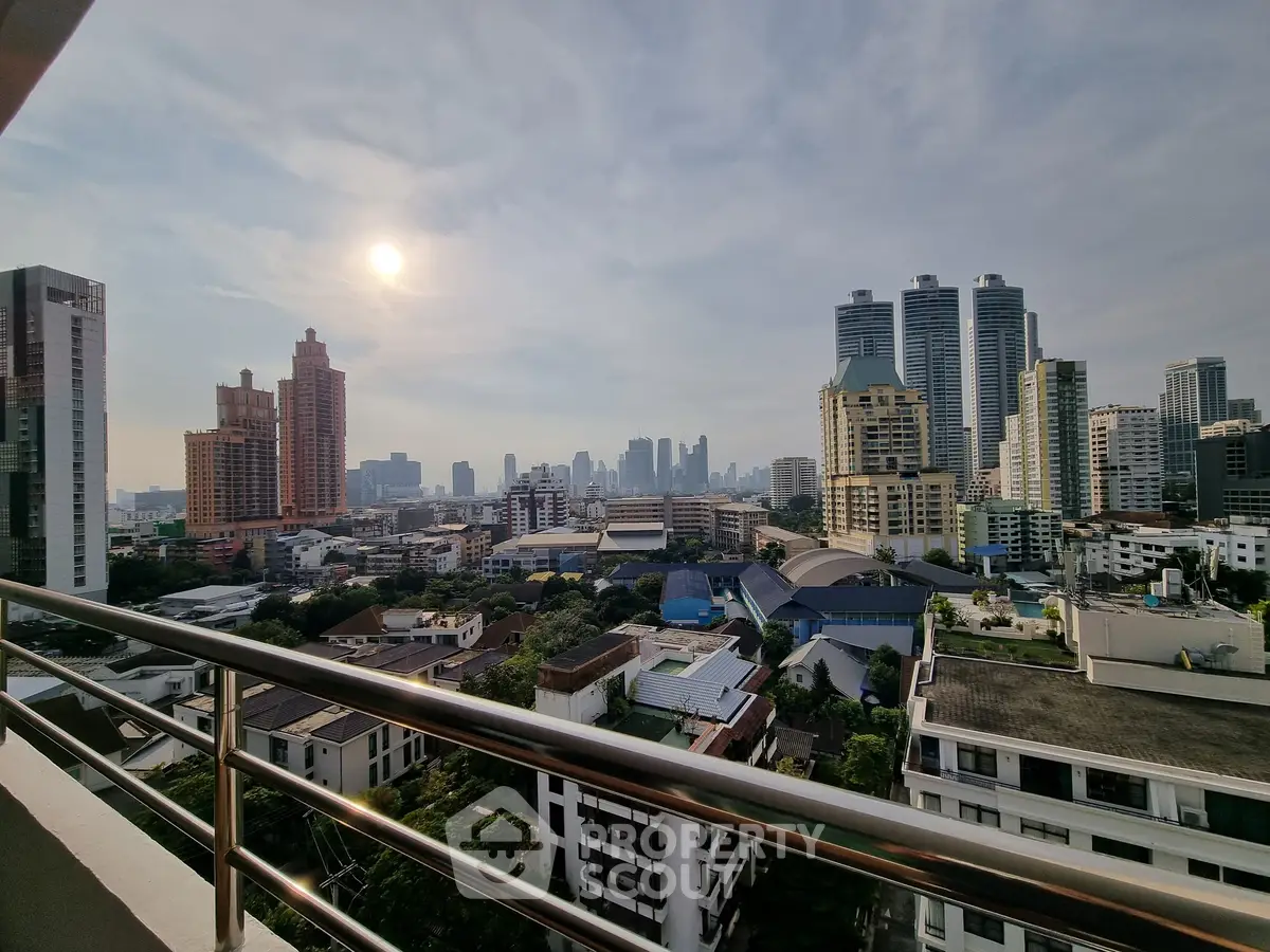 Stunning cityscape view from a high-rise balcony with modern skyline.