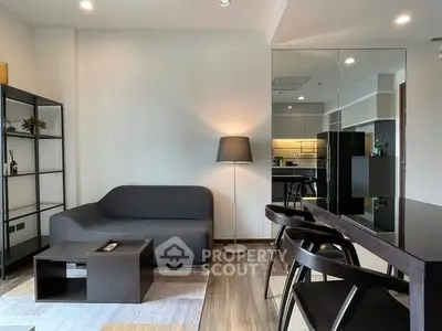 Modern living room with sleek furniture and open kitchen layout