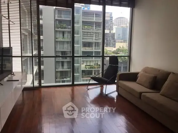 Spacious living room with city view and modern furnishings