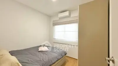 Cozy bedroom with modern air conditioning and natural light