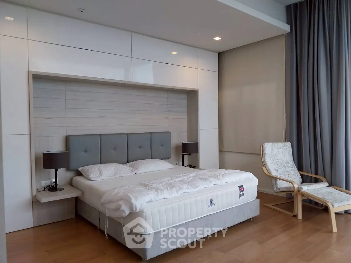 Modern bedroom with stylish decor and comfortable bed in a luxury apartment.