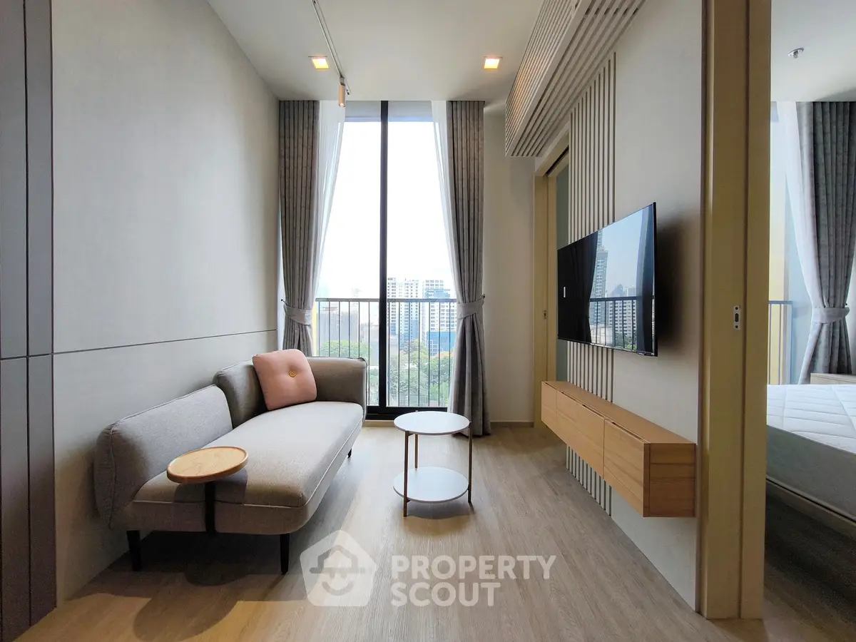 Modern living room with stylish sofa and city view balcony