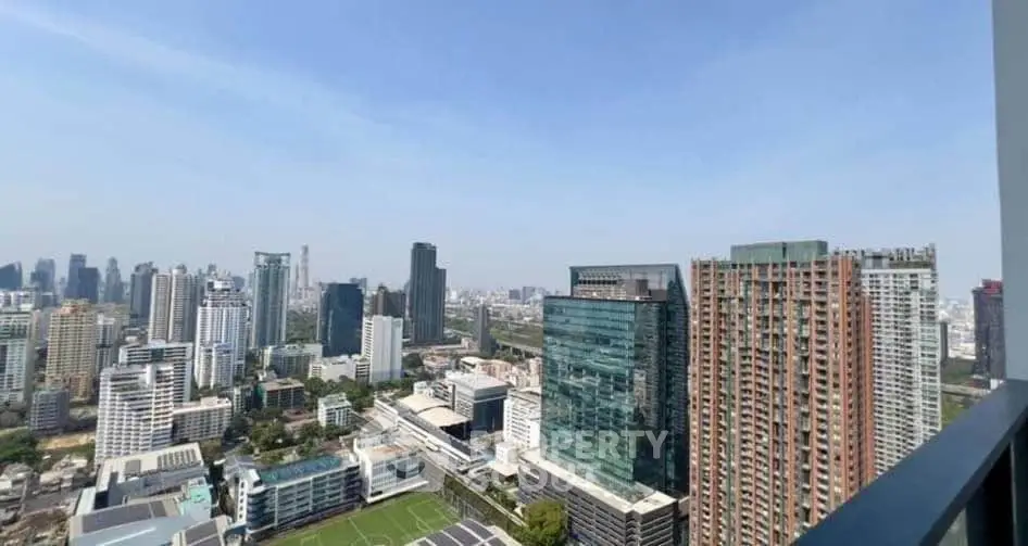 Stunning cityscape view from high-rise balcony showcasing modern urban skyline.