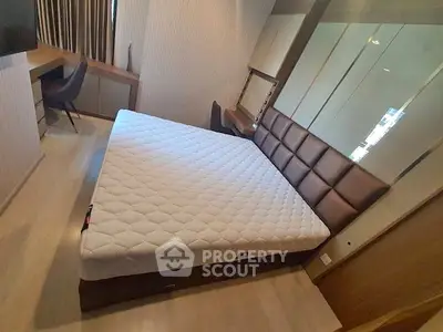 Modern bedroom with stylish decor and comfortable bed in a contemporary apartment.
