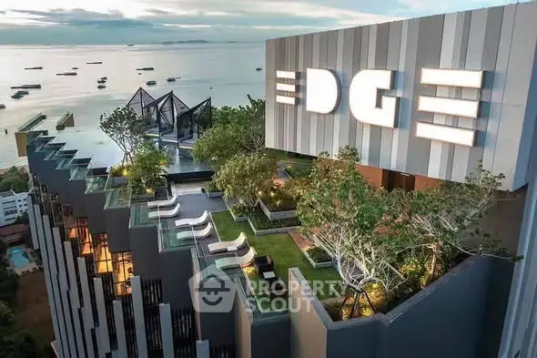 Luxurious rooftop garden with stunning ocean view at modern high-rise building.