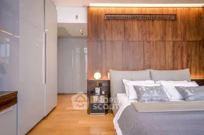Luxurious modern bedroom with elegant wooden paneling and stylish decor
