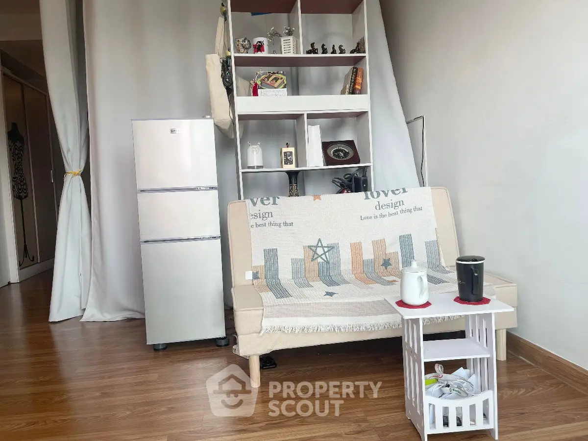 Cozy living room with modern fridge and stylish decor