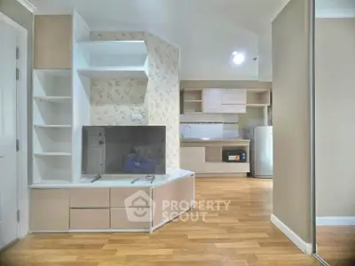 Modern living room with stylish TV unit and open kitchen layout