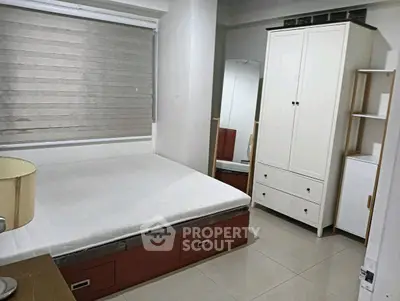 Cozy bedroom with modern furniture and ample storage space