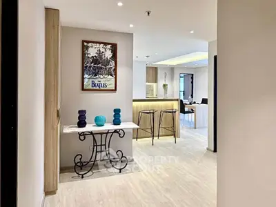 Modern open-layout apartment with stylish decor and breakfast bar, perfect for contemporary living.