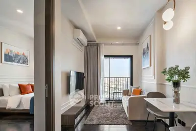 Modern apartment interior with cozy living room and bedroom, featuring stylish decor and city view balcony.