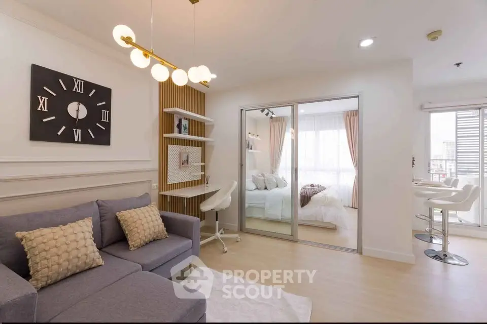 Modern living room with stylish decor and cozy bedroom view