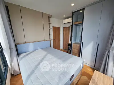 Modern bedroom with stylish furniture and ample natural light