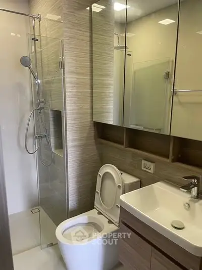 Modern bathroom with glass shower and sleek fixtures