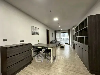 Spacious modern living room with sleek furniture and large windows