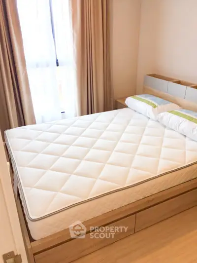 Cozy bedroom with natural light and modern furnishings