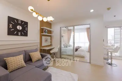 Modern living room with cozy sofa and stylish decor in open-plan apartment