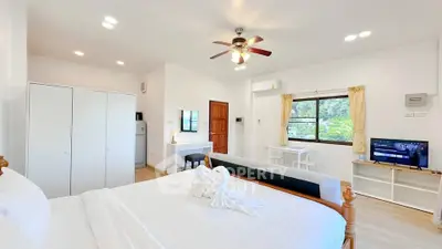 Bright and airy bedroom with modern decor and scenic window view