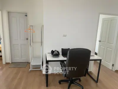 Modern study room with sleek desk and comfortable chair, perfect for productivity.